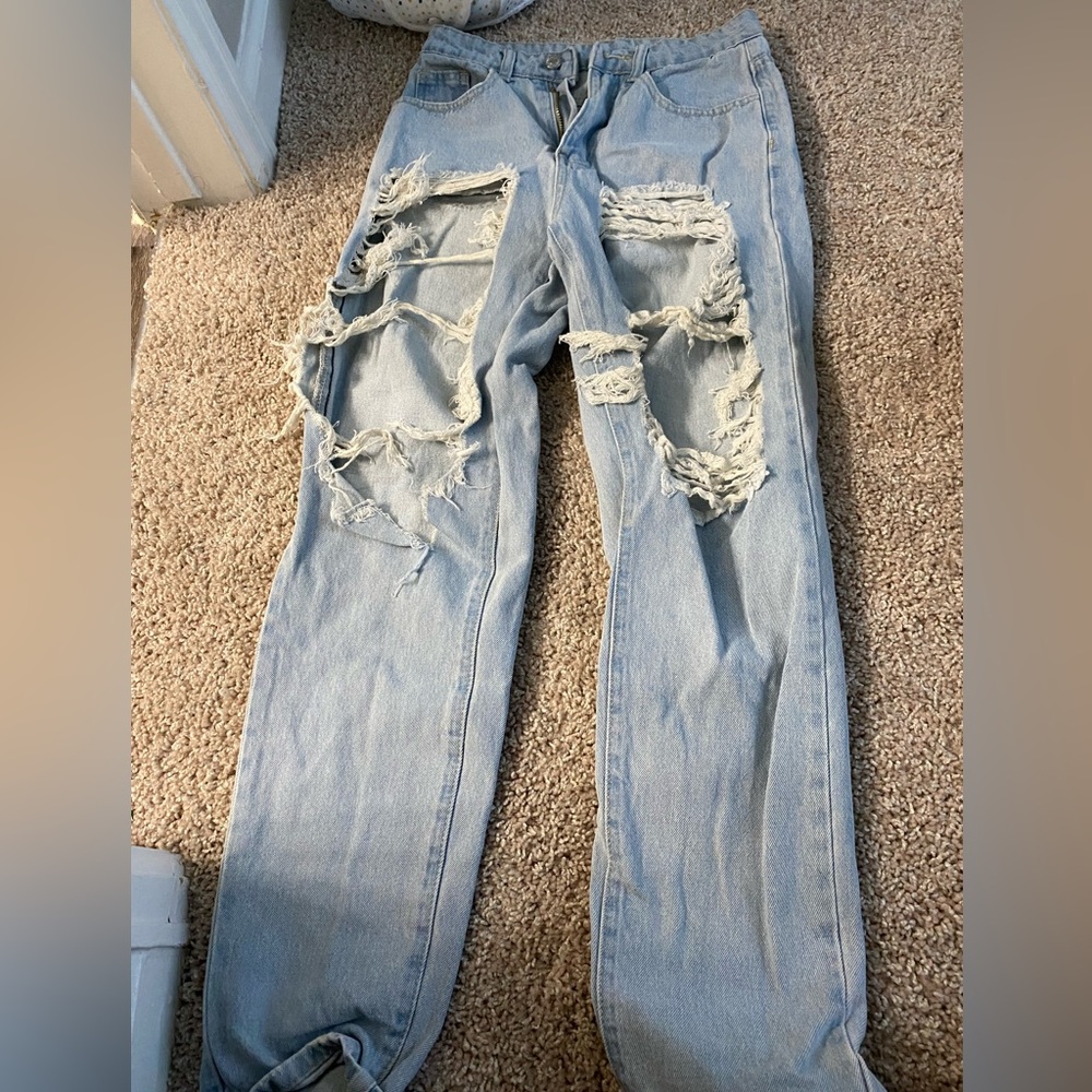 Light was jeans with two big holes